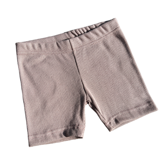 Pair of dusty pink shorts on a white background