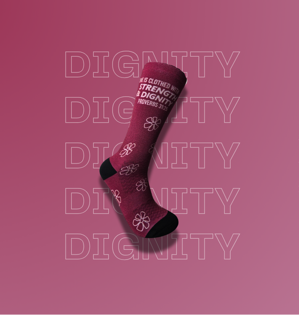 Dark pink activewear sock with text that says: "She is clothed in Strength and Dignity"